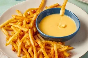 Air Fryer Crispy Seasoned Fast-Style Fries with Spicy Cheese Sauce